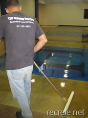 Doug applying the floor finish to a stained concrete project